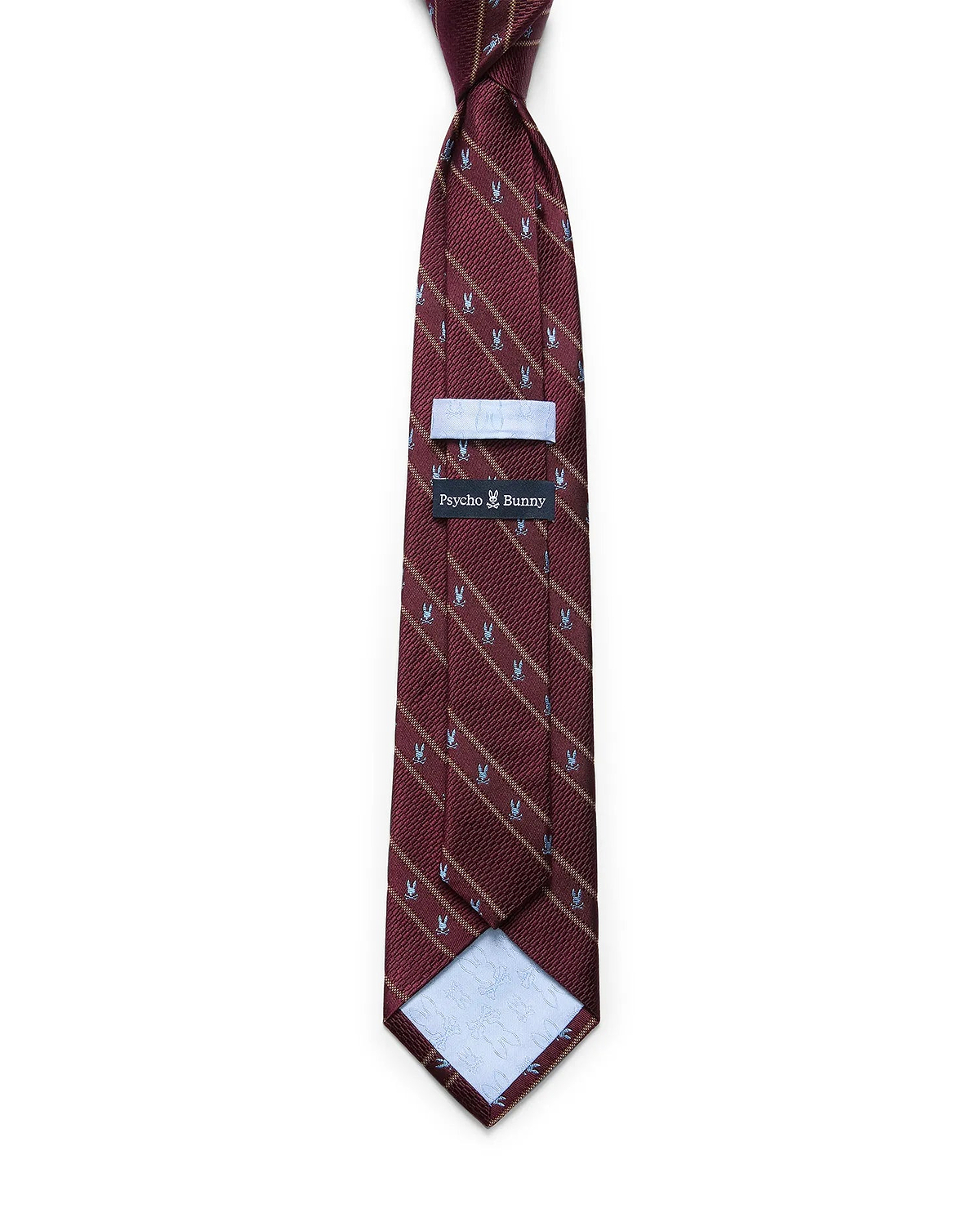 Mens Bunny Stripe Woven Tie in burgundy with diagonal gold stripes and a repeating light blue Psycho Bunny skull pattern. Woven texture, with a Psycho Bunny brand tag on the back.
