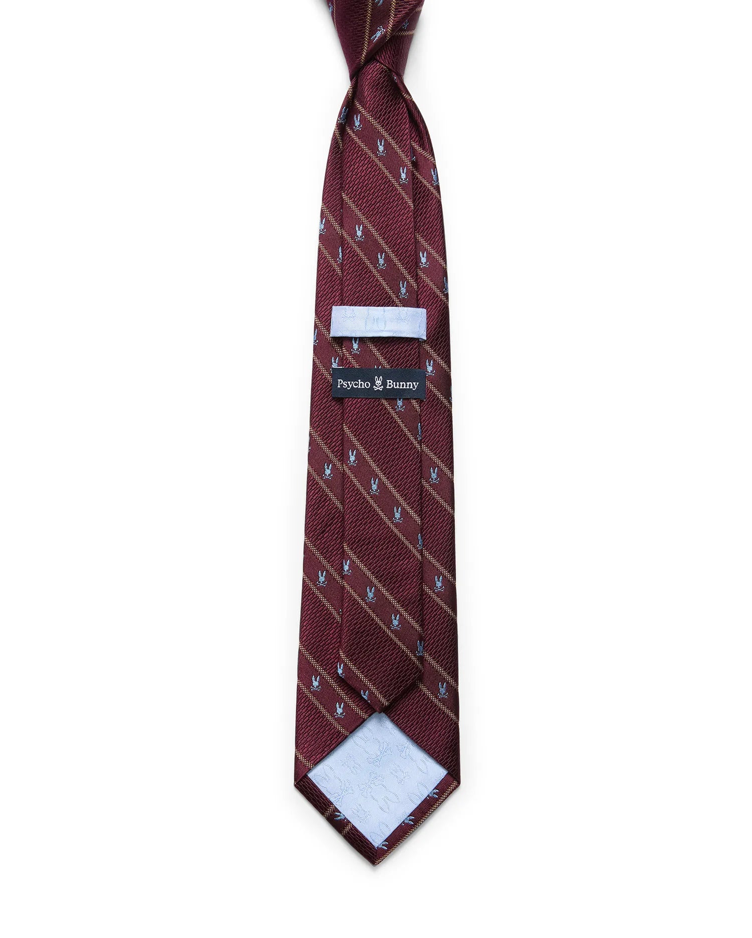 Mens Bunny Stripe Woven Tie in burgundy with diagonal gold stripes and a repeating light blue Psycho Bunny skull pattern. Woven texture, with a Psycho Bunny brand tag on the back.