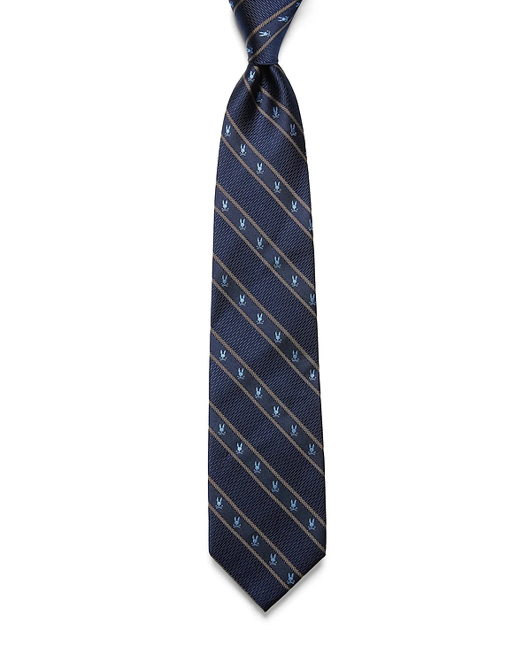 MENS BUNNY STRIPE WOVEN TIE in navy blue, featuring diagonal tan stripes and repeating small light blue Psycho Bunny skull logos in a refined woven texture.
