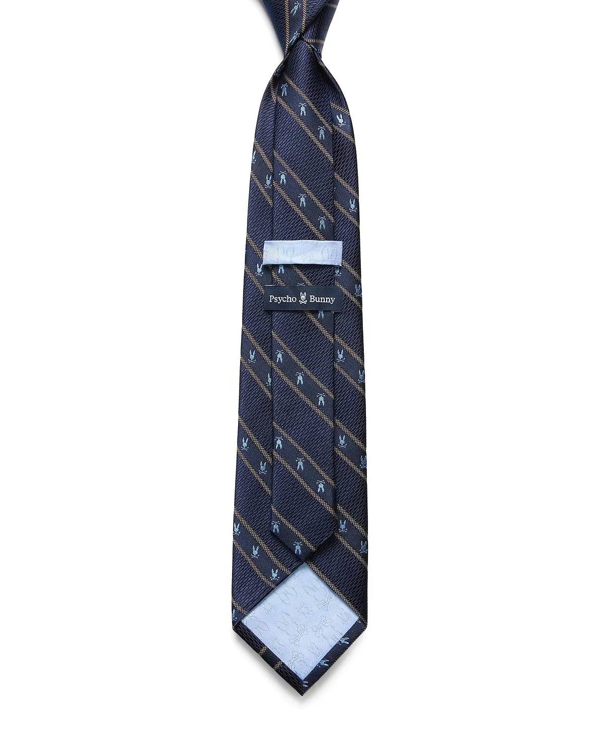 Mens Bunny Stripe Woven Tie, navy with diagonal gold stripes and repeating light blue Psycho Bunny skull logos. Woven texture, Psycho Bunny logo on keeper, embossed skulls on light blue lining.