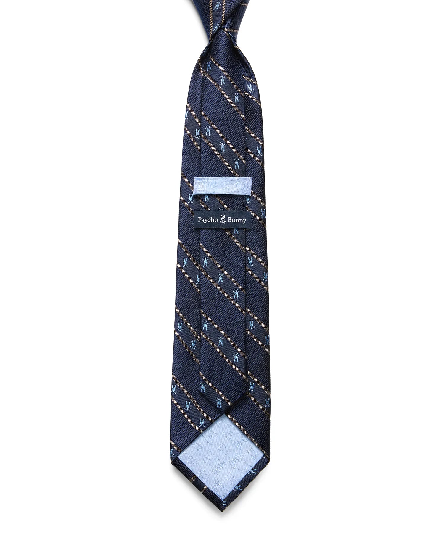 Mens Bunny Stripe Woven Tie, navy with diagonal gold stripes and repeating light blue Psycho Bunny skull logos. Woven texture, Psycho Bunny logo on keeper, embossed skulls on light blue lining.