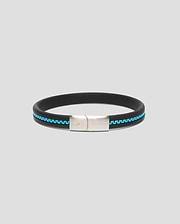 Mens Link Rubber Bracelet, a sleek black rubber band with a vibrant turquoise chain-link inlay and a polished silver clasp featuring engraved Psycho Bunny branding and skull logo.