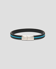 Mens Link Rubber Bracelet, a sleek black rubber band with a vibrant turquoise chain-link inlay and a polished silver clasp featuring engraved Psycho Bunny branding and skull logo.