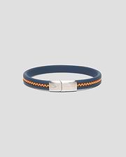 Mens Link Rubber Bracelet in navy blue rubber with an embedded orange chain detail, featuring a silver-toned metal clasp engraved with the Psycho Bunny skull logo and text.