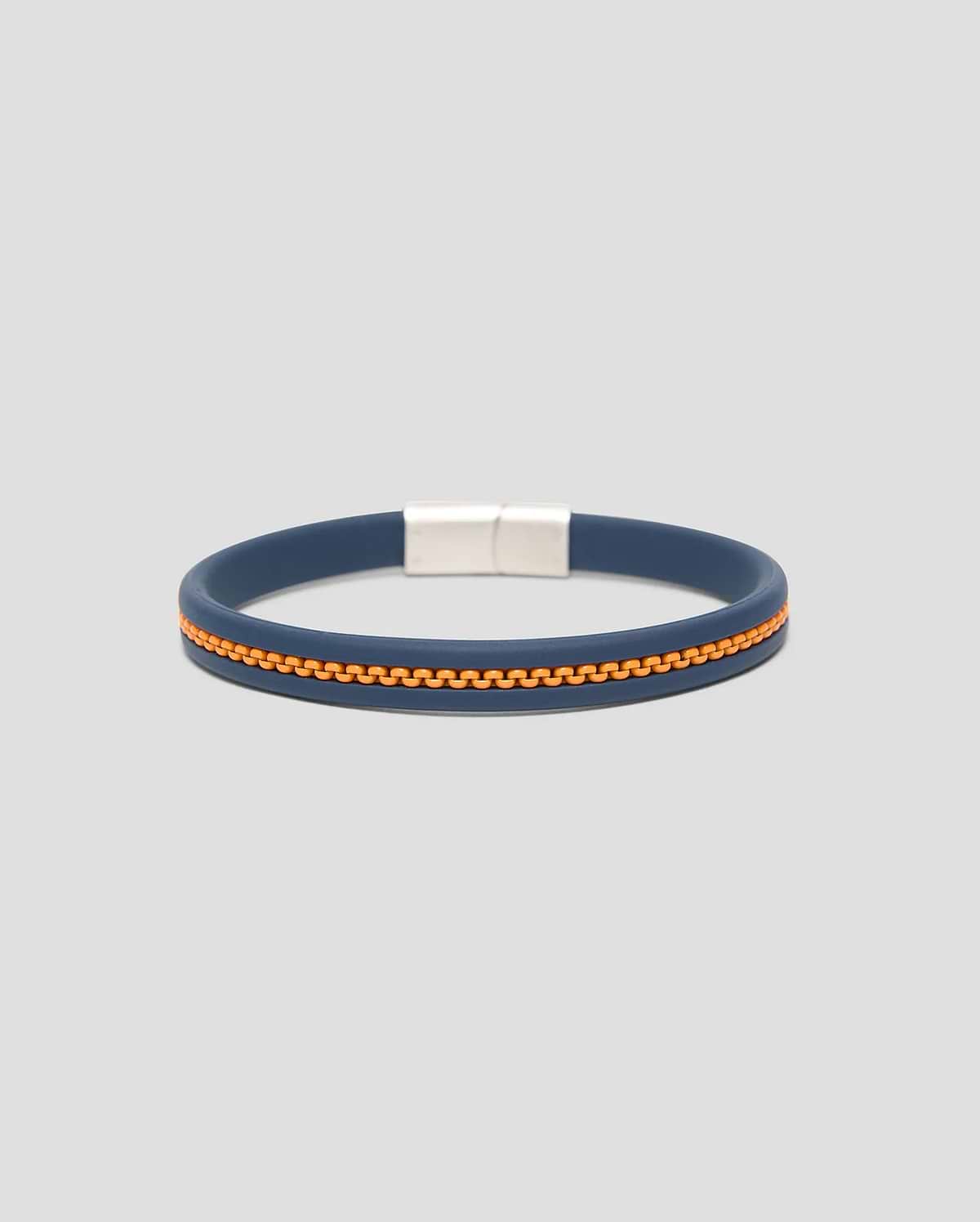 Mens Link Rubber Bracelet, a sleek navy blue rubber band featuring a vibrant orange zipper-like textured stripe and a polished silver rectangular magnetic clasp.