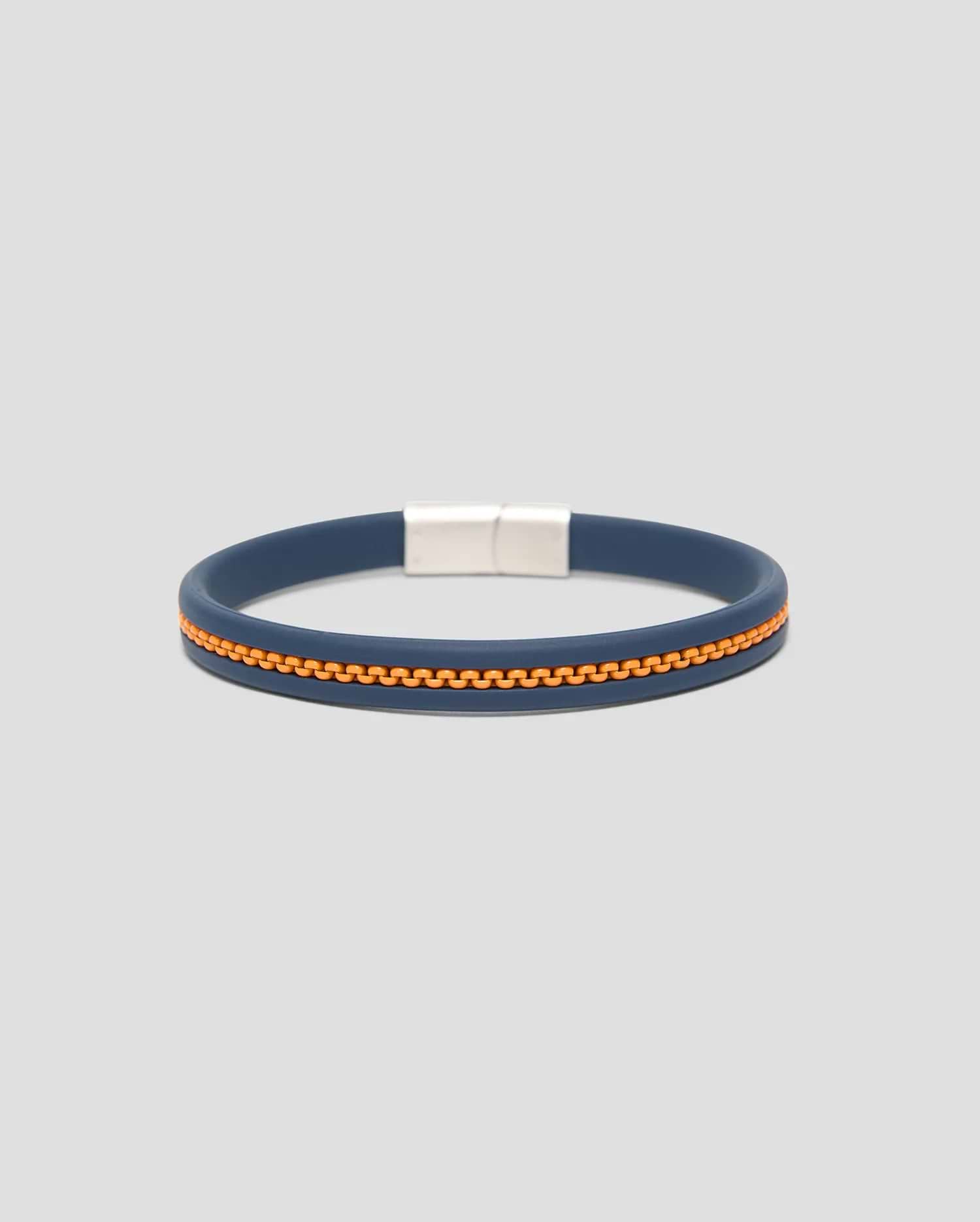 Mens Link Rubber Bracelet, a sleek navy blue rubber band featuring a vibrant orange zipper-like textured stripe and a polished silver rectangular magnetic clasp.