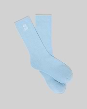 Mens New Classic Sport Sock, light blue, with a white embroidered Psycho Bunny skull logo prominently displayed on the ribbed cuff, featuring a smooth knit body. (1)