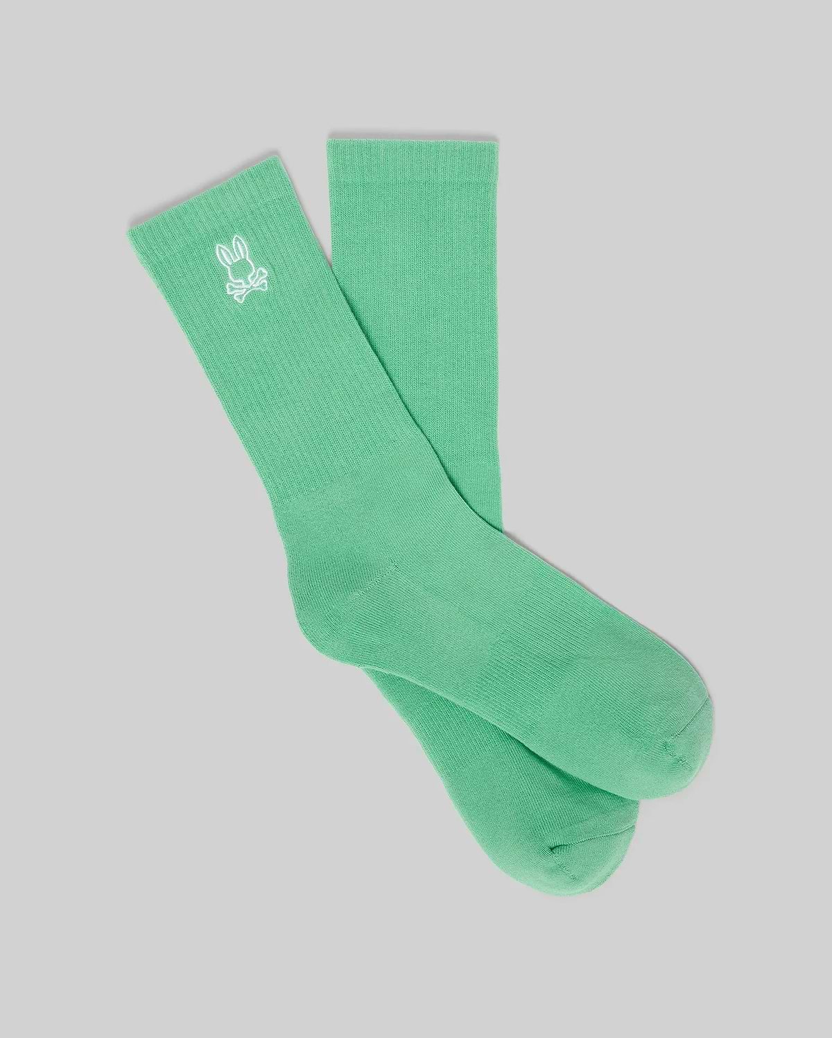 Premium mint green ribbed knit crew socks featuring a small, crisp white embroidered Psycho Bunny skull logo on the outer ankle cuff. Mens New Classic Sport Sock. (1)