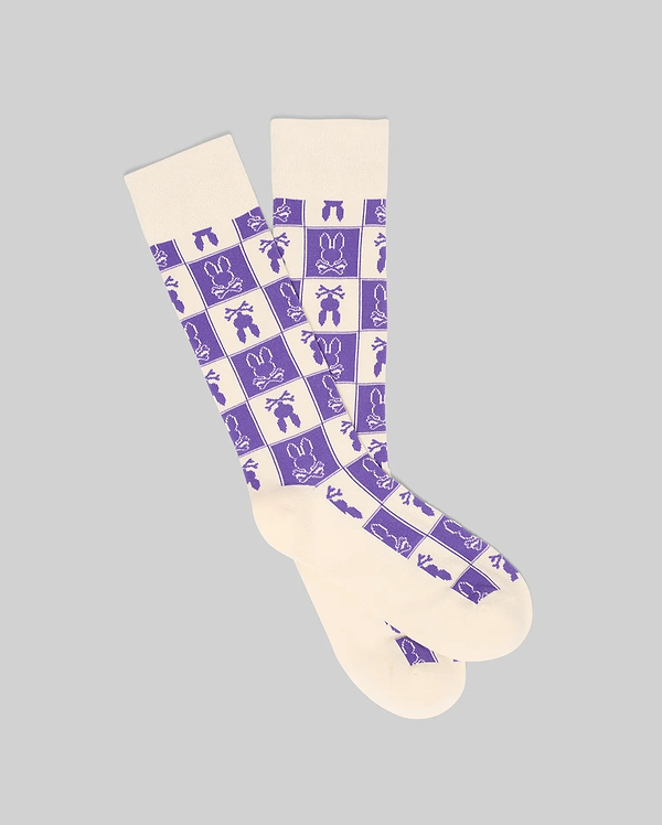 Mens All Over Square Bunny Dress Sock in cream with a purple checkerboard pattern featuring alternating Psycho Bunny skull logos, carrots, and bunny silhouettes.