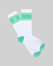 Mens Striped Sport Sock in white knit, featuring a vibrant green striped cuff with an embroidered white Psycho Bunny skull logo, and green heel and toe accents. (1)