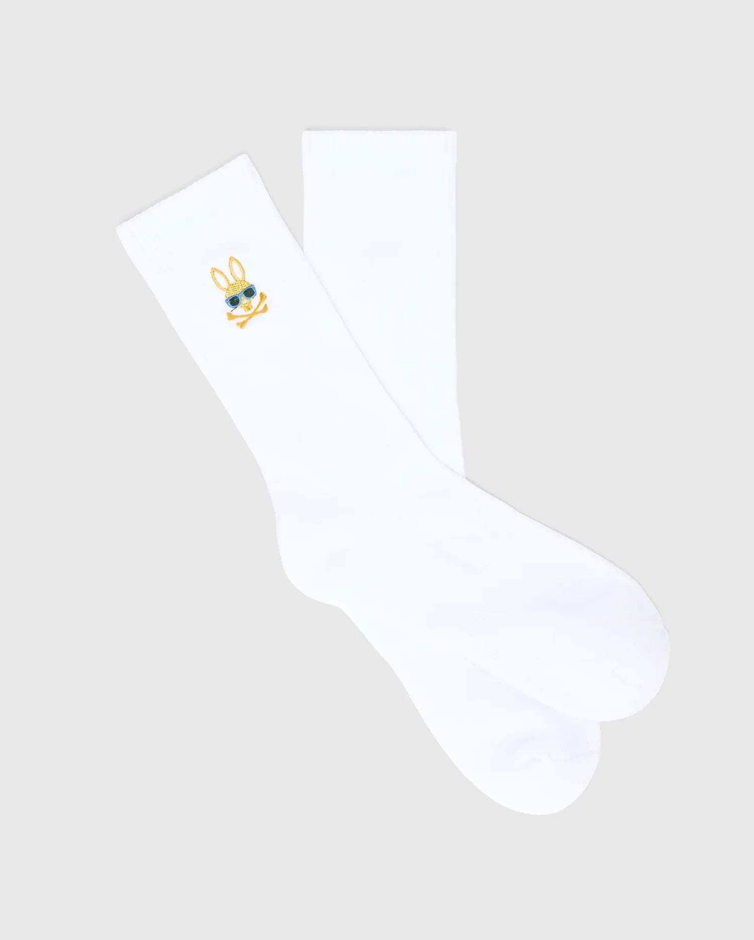White Mens Sunny Sport Sock featuring a small, embroidered gold and blue Psycho Bunny skull logo with sunglasses on the outer cuff, crafted from smooth knit fabric.