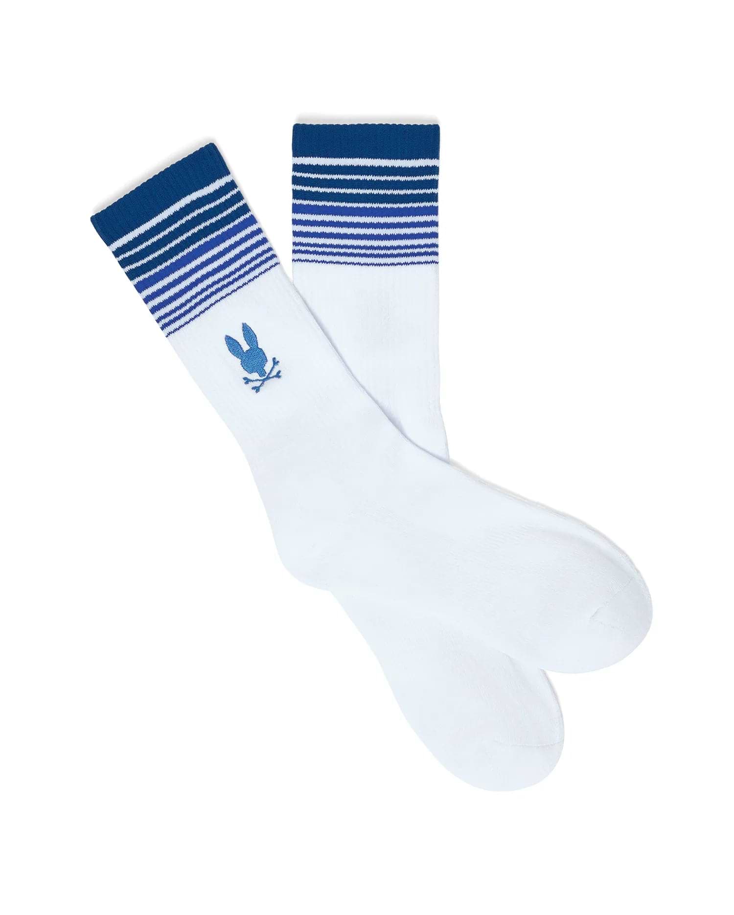 MENS GRADIENT SPORT SOCK, white knit socks featuring a ribbed cuff with varying shades of blue gradient stripes and a prominent embroidered blue Psycho Bunny skull logo on the ankle.
