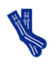 Mens Ty Sport Sock in vibrant royal blue knit, featuring a prominent white Psycho Bunny skull logo graphic on the calf, flanked by two vertical white stripes and two horizontal white stripes below.