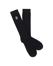 Mens Nathaniel Dress Sock, a pair of premium black ribbed knit dress socks featuring the iconic small white embroidered Psycho Bunny skull logo prominently placed near the cuff.
