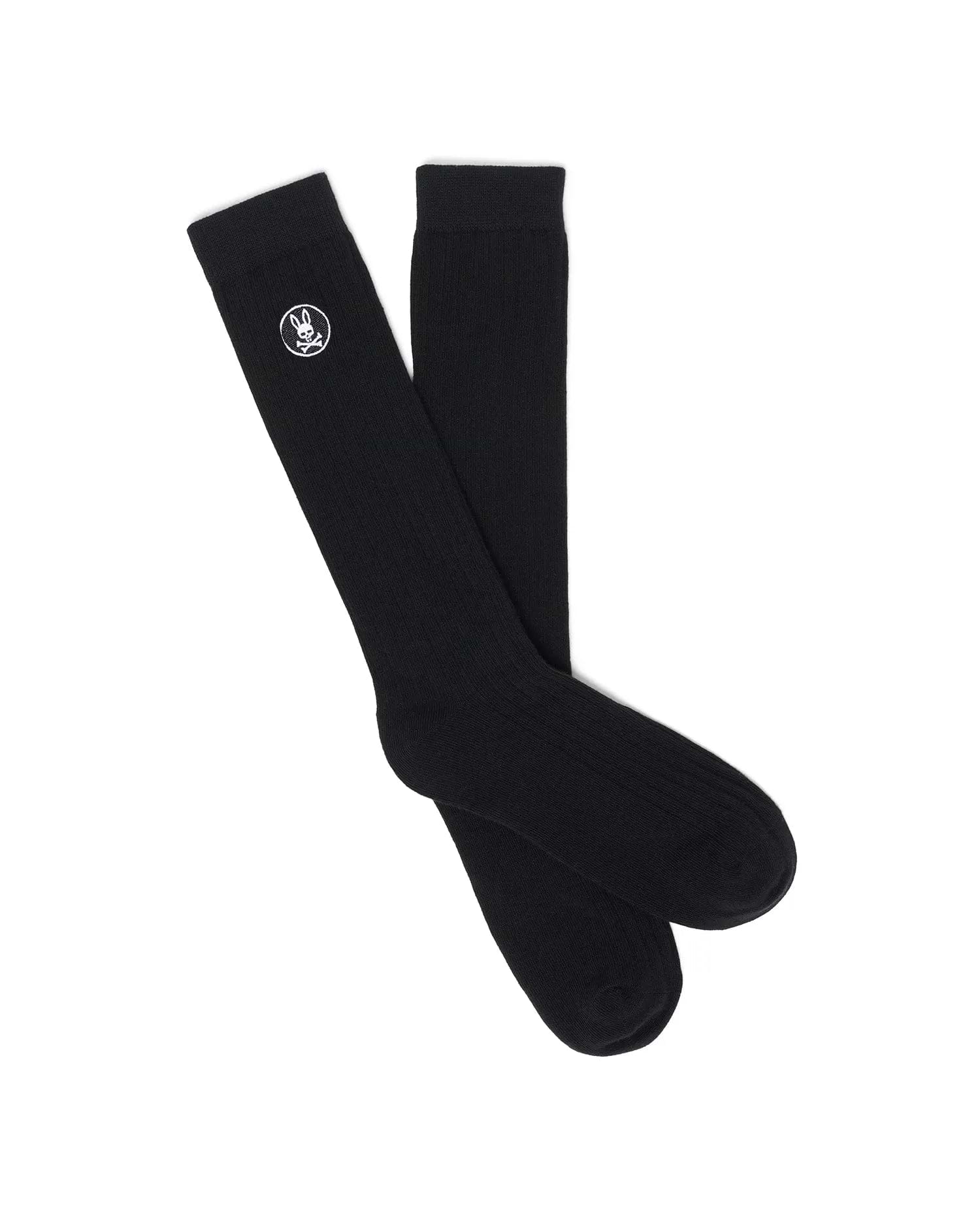 Mens Nathaniel Dress Sock, a pair of premium black ribbed knit dress socks featuring the iconic small white embroidered Psycho Bunny skull logo prominently placed near the cuff.