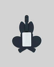 The Psycho Bunny MENS RACKET BUNNY LUGGAGE TAG (MO2400003) features a dark, bunny-shaped silicone design with a white info label and simple strap, shown on a plain light gray background. (2)