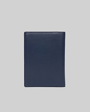 Premium Navy Passport Holder by Psycho Bunny, crafted from smooth, fine-grain leather with precise tonal stitching along the edges, offering a refined and durable travel accessory.