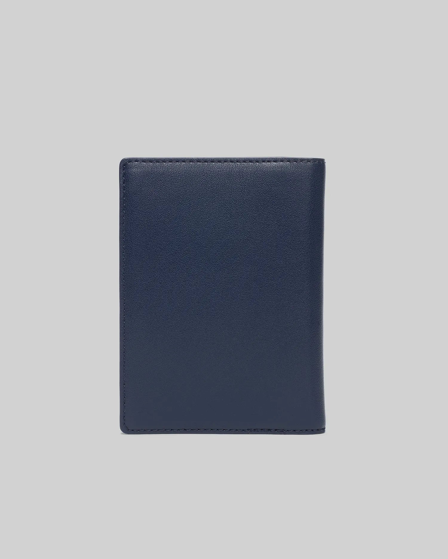 Premium Navy Passport Holder by Psycho Bunny, crafted from smooth, fine-grain leather with precise tonal stitching along the edges, offering a refined and durable travel accessory.