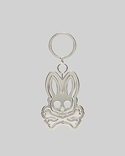Silver metallic Spinning Bunny Keychain featuring the iconic Psycho Bunny skull and crossbones logo design with a hollowed-out center, attached to a classic key ring.