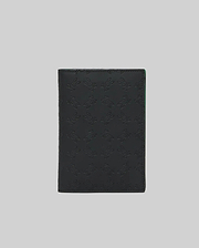 Black Passport Holder with an all-over embossed Psycho Bunny skull logo pattern and subtle green accent on the interior edge, crafted from smooth, premium material. (2)
