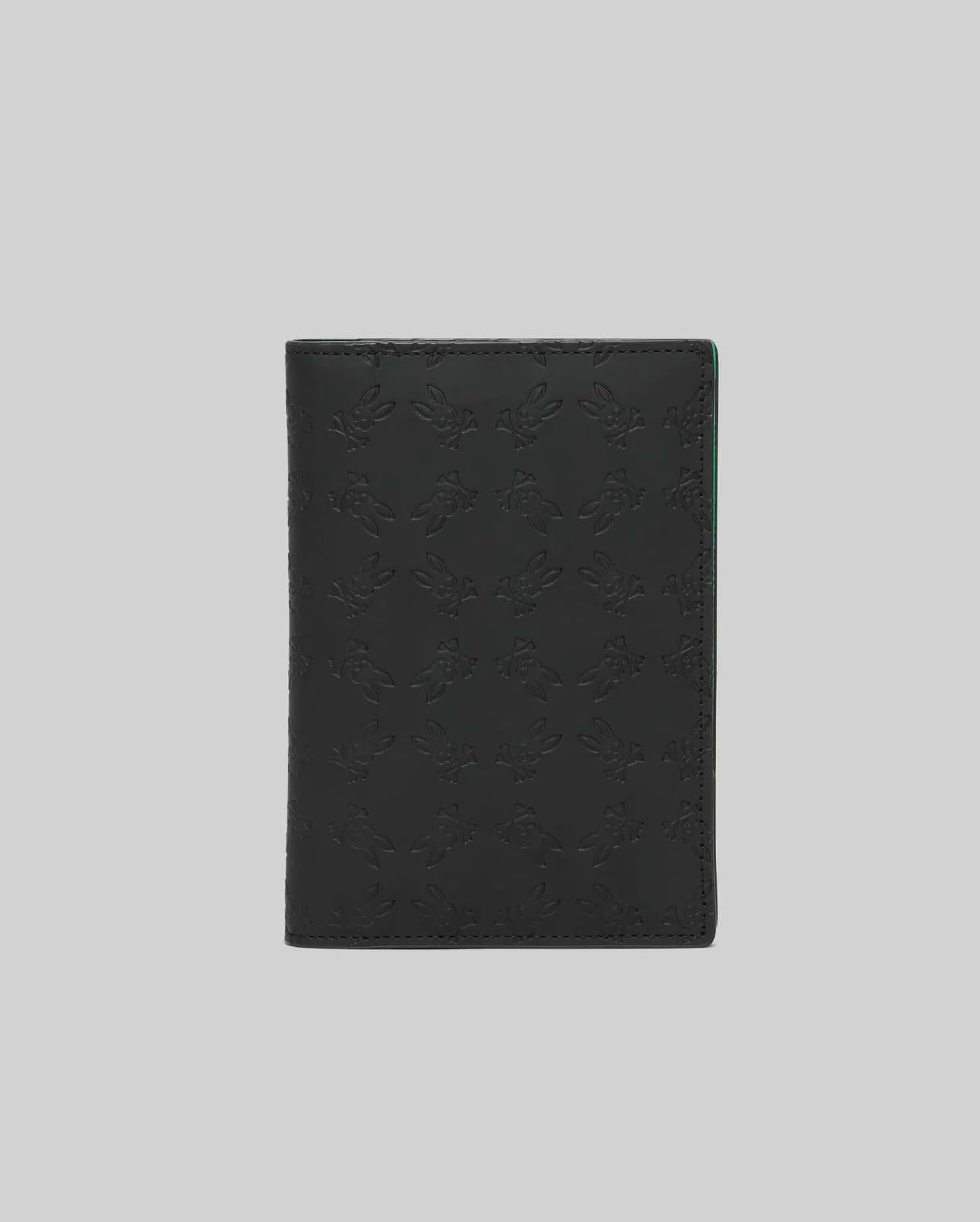 Black Passport Holder with an all-over embossed Psycho Bunny skull logo pattern and subtle green accent on the interior edge, crafted from smooth, premium material. (2)