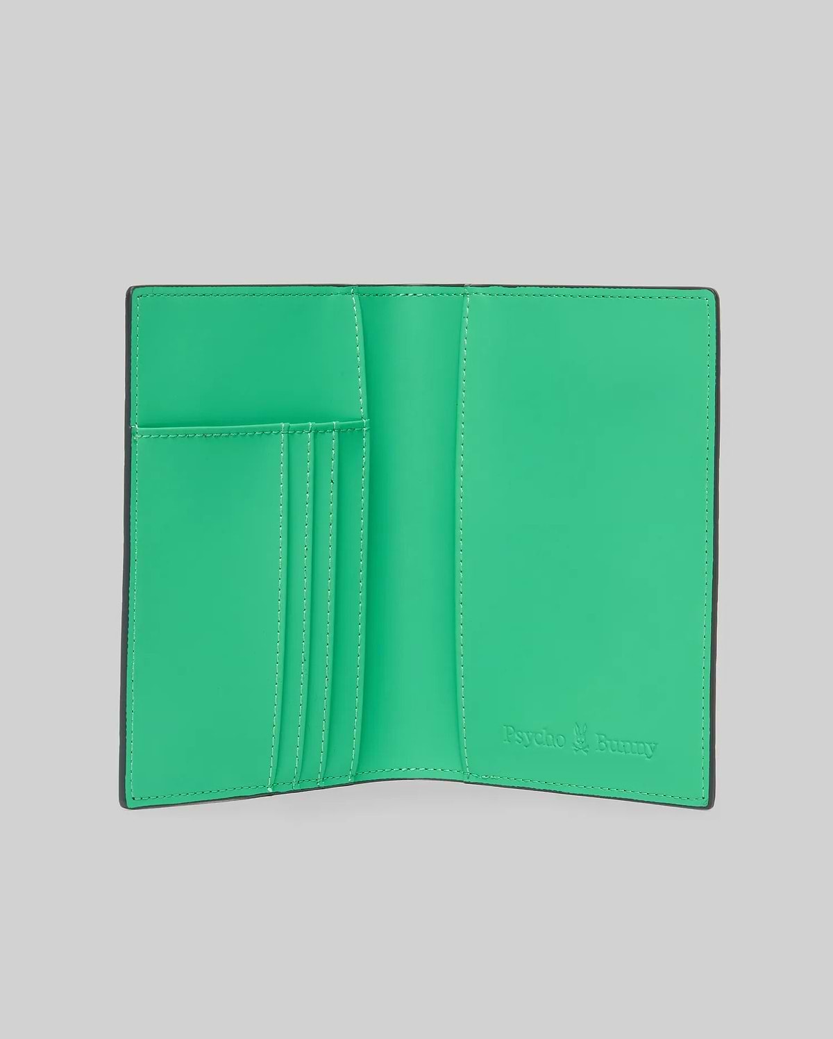 Passport Holder with a smooth, vibrant green interior and black trim, featuring multiple card slots and an embossed Psycho Bunny logo on the right, accented with white stitching. (3)