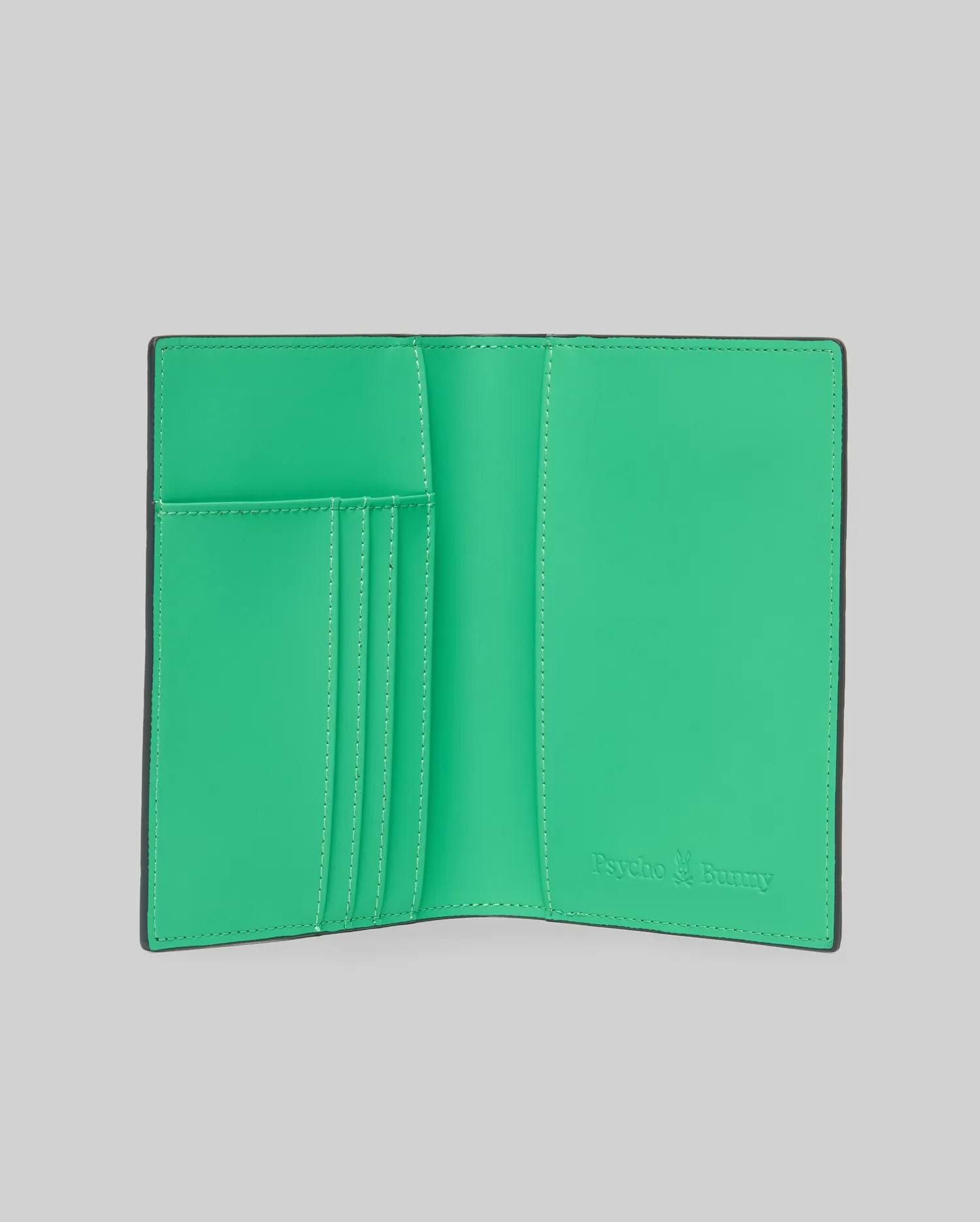Passport Holder with a smooth, vibrant green interior and black trim, featuring multiple card slots and an embossed Psycho Bunny logo on the right, accented with white stitching. (3)