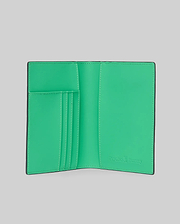 Passport Holder with a smooth, vibrant green interior and black trim, featuring multiple card slots and an embossed Psycho Bunny logo on the right, accented with white stitching. (3)