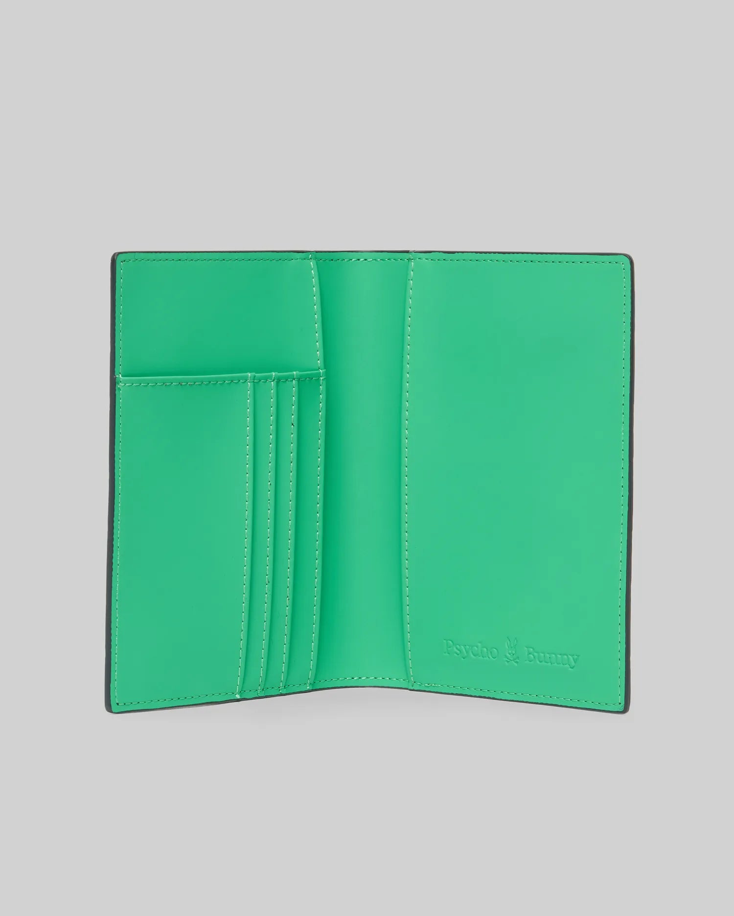 Passport Holder with a smooth, vibrant green interior and black trim, featuring multiple card slots and an embossed Psycho Bunny logo on the right, accented with white stitching. (3)