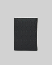 Black Passport Holder featuring a refined, all-over embossed Psycho Bunny skull logo pattern on its smooth, premium leather-like surface, showcasing distinctive brand identity. (4)