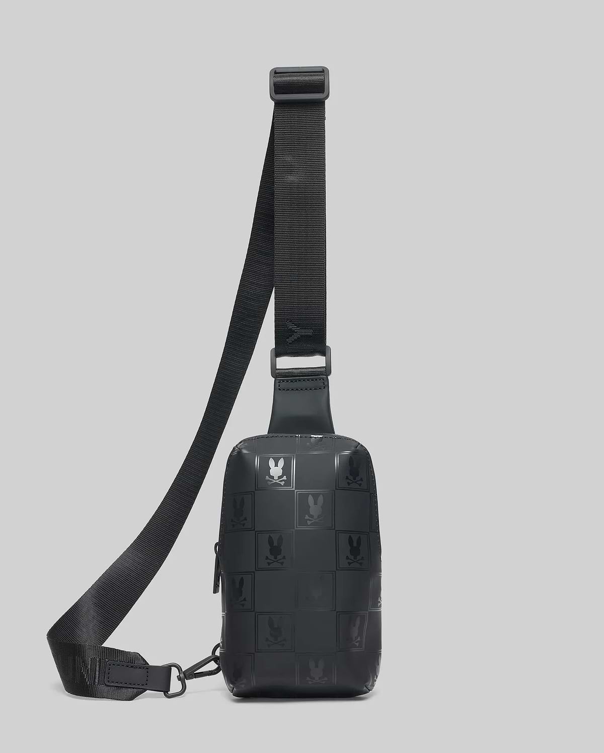 Black Mens Rubberized Crossbody with an all-over embossed checkerboard pattern featuring the iconic Psycho Bunny skull logo and an adjustable strap.