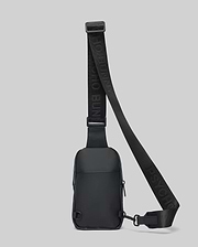 Black Mens Rubberized Crossbody bag featuring a sleek, smooth finish, an adjustable woven strap with repeated Psycho Bunny text logo, and secure zippered compartments.