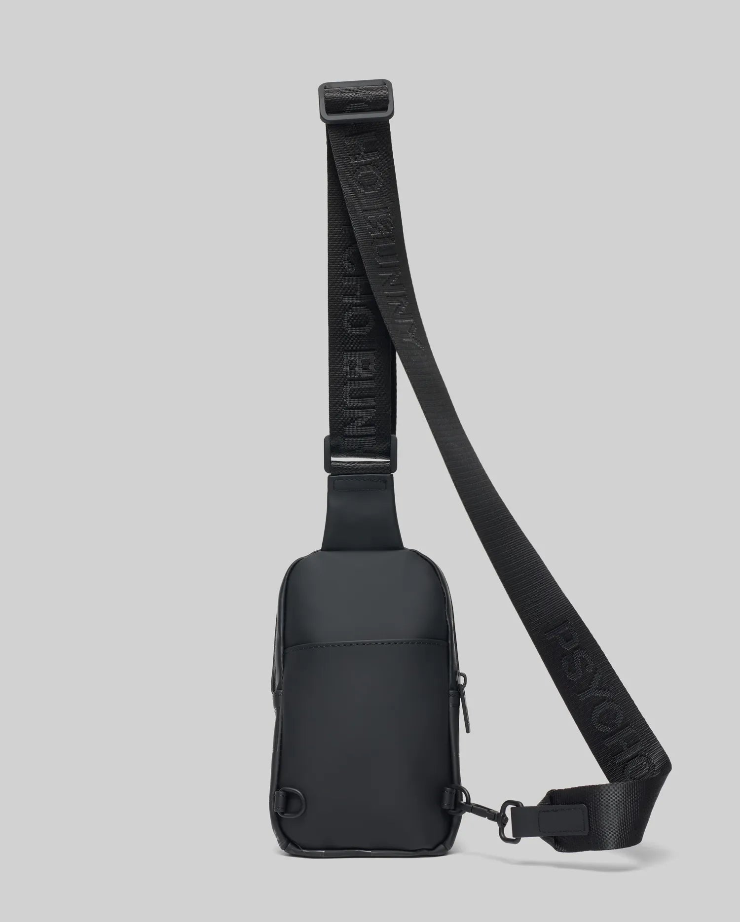 Black Mens Rubberized Crossbody bag featuring a sleek, smooth finish, an adjustable woven strap with repeated Psycho Bunny text logo, and secure zippered compartments.
