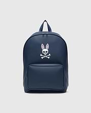 Classic Bunny Backpack in navy blue, featuring a large white Psycho Bunny skull logo with pink ear outlines centered on the front, a smooth texture, and a zippered front pocket.