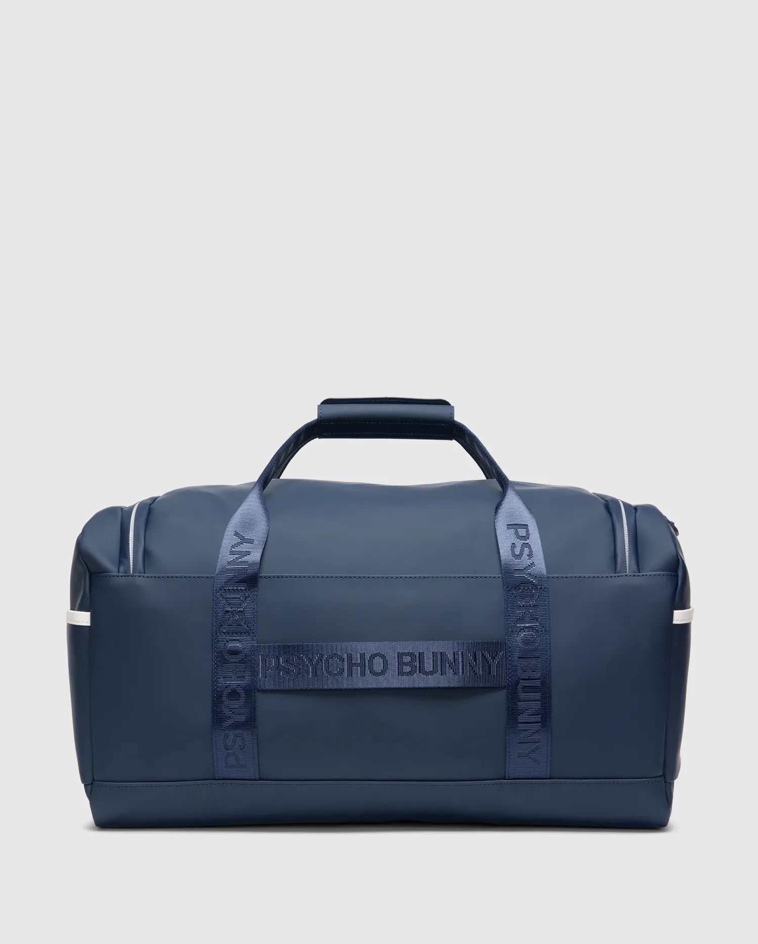 Classic Bunny Gym Bag in navy blue, featuring smooth matte material, white side stripes, and prominent Psycho Bunny text branding on the woven carry straps.