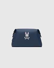 Classic Bunny Toiletry Kit in navy blue with a smooth, matte finish, featuring a large white Psycho Bunny skull logo with pink ear accents centered on the front.