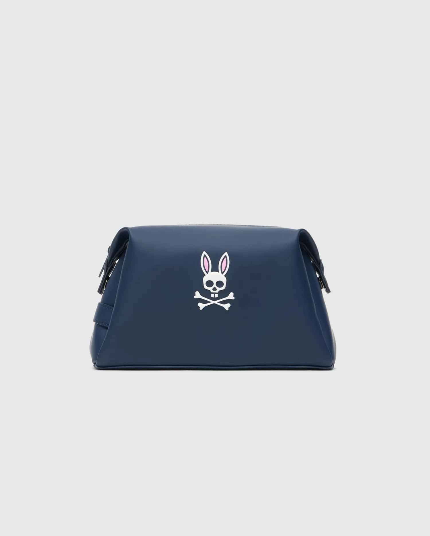 Classic Bunny Toiletry Kit in navy blue with a smooth, matte finish, featuring a large white Psycho Bunny skull logo with pink ear accents centered on the front.