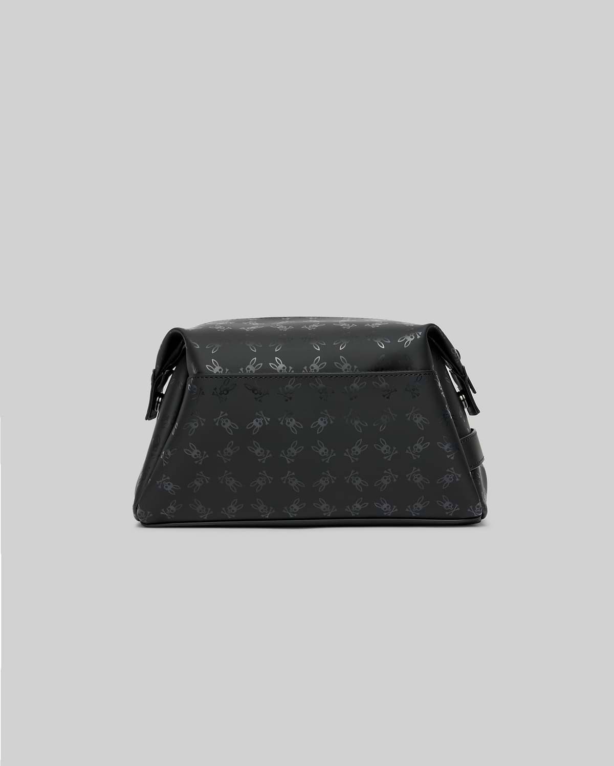 Mens All Over Bunny Toiletry Kit, a sleek black bag featuring a subtle all-over embossed Psycho Bunny skull logo pattern, crafted with a smooth, structured finish.