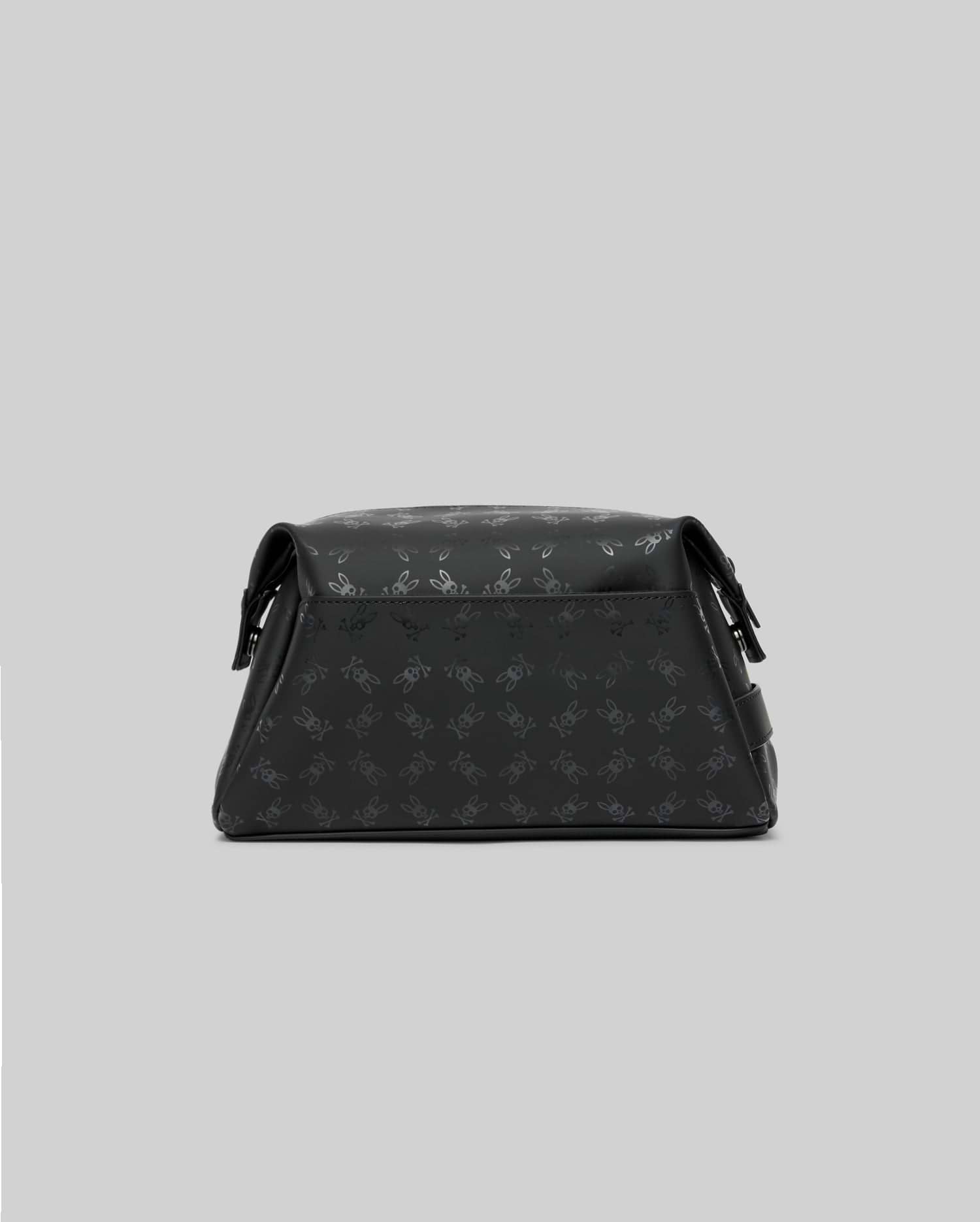 Mens All Over Bunny Toiletry Kit, a sleek black bag featuring a subtle all-over embossed Psycho Bunny skull logo pattern, crafted with a smooth, structured finish.