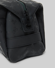 Mens All Over Bunny Toiletry Kit, black with an all-over subtle Psycho Bunny skull logo pattern, smooth texture, top zipper closure with branded pull, and a side strap.