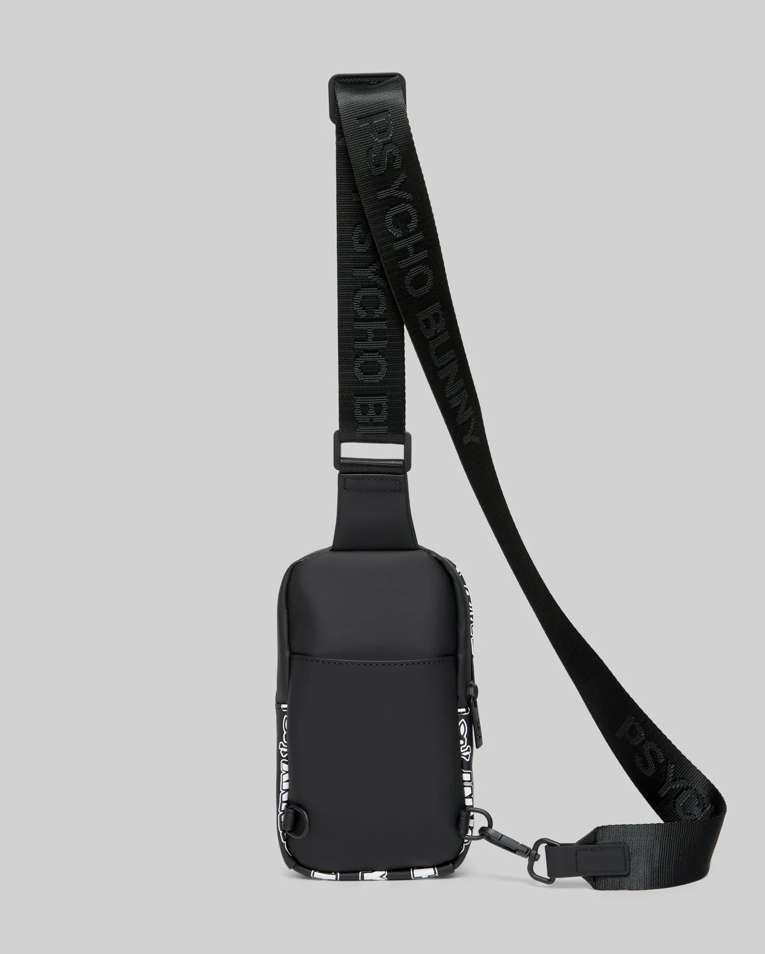Mens Rubberized Crossbody, black with white all-over Psycho Bunny skull pattern on sides, featuring an adjustable strap with repeating Psycho Bunny text logos.