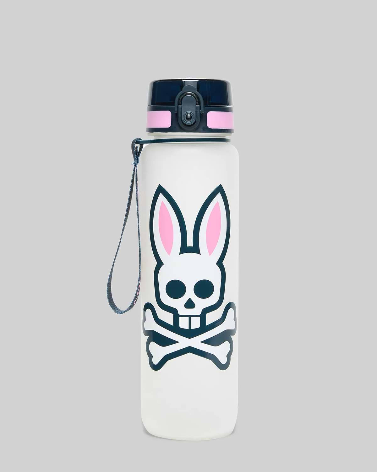 White 33 Oz Water Bottle featuring a large, centered Psycho Bunny skull graphic with navy outline, crossbones, and pink inner ears, topped with a navy blue lid and pink accent band.