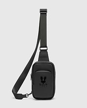 Black Crossbody Bag crafted from a refined Saffiano-style textured material, featuring a prominent glossy black Psycho Bunny skull logo on the front pocket and a durable adjustable strap. (1)