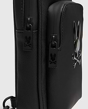 Black Crossbody Bag with durable textured fabric, featuring a prominent glossy raised Psycho Bunny skull logo and custom black zipper pulls with the logo. (3)