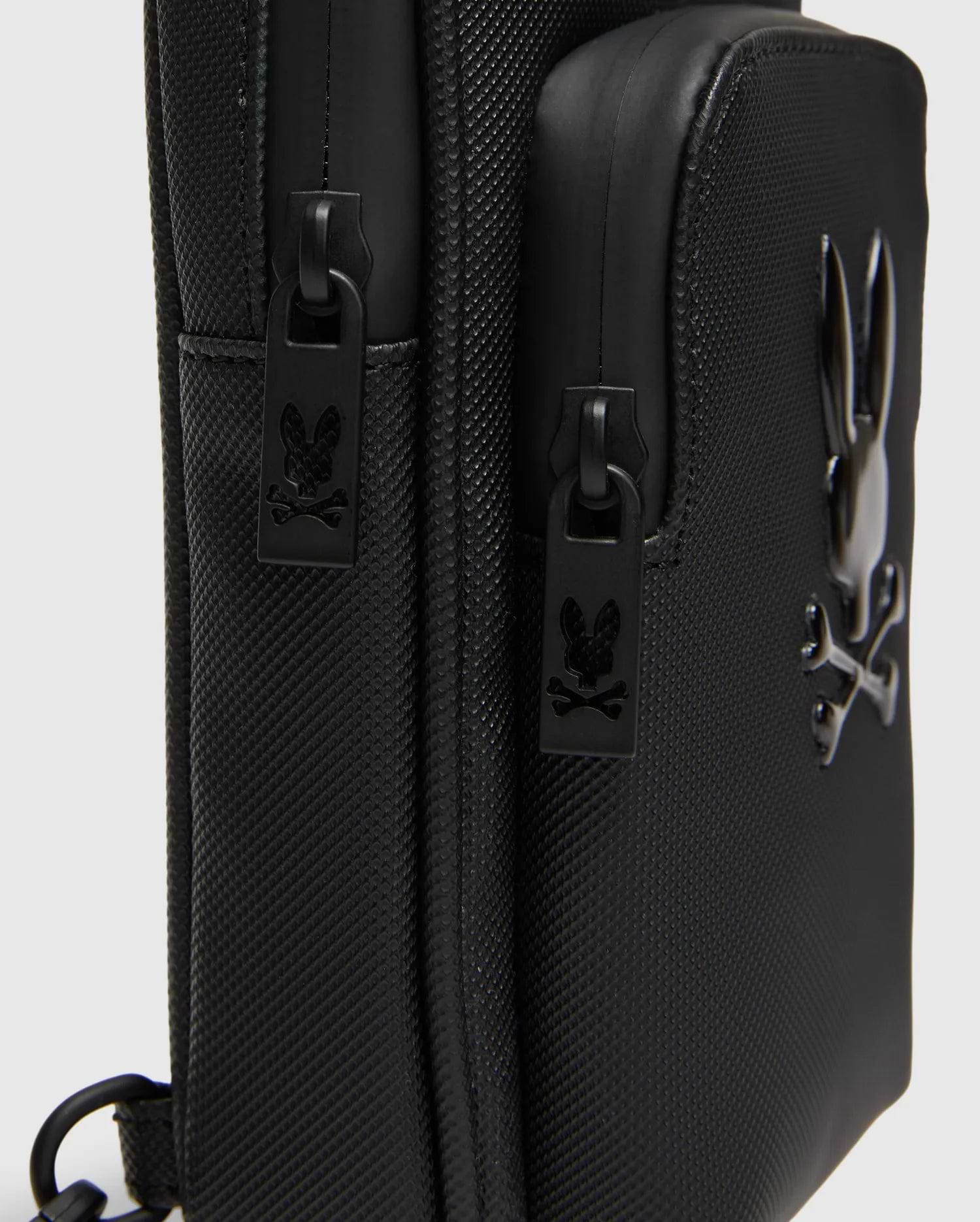 Black Crossbody Bag with durable textured fabric, featuring a prominent glossy raised Psycho Bunny skull logo and custom black zipper pulls with the logo. (3)