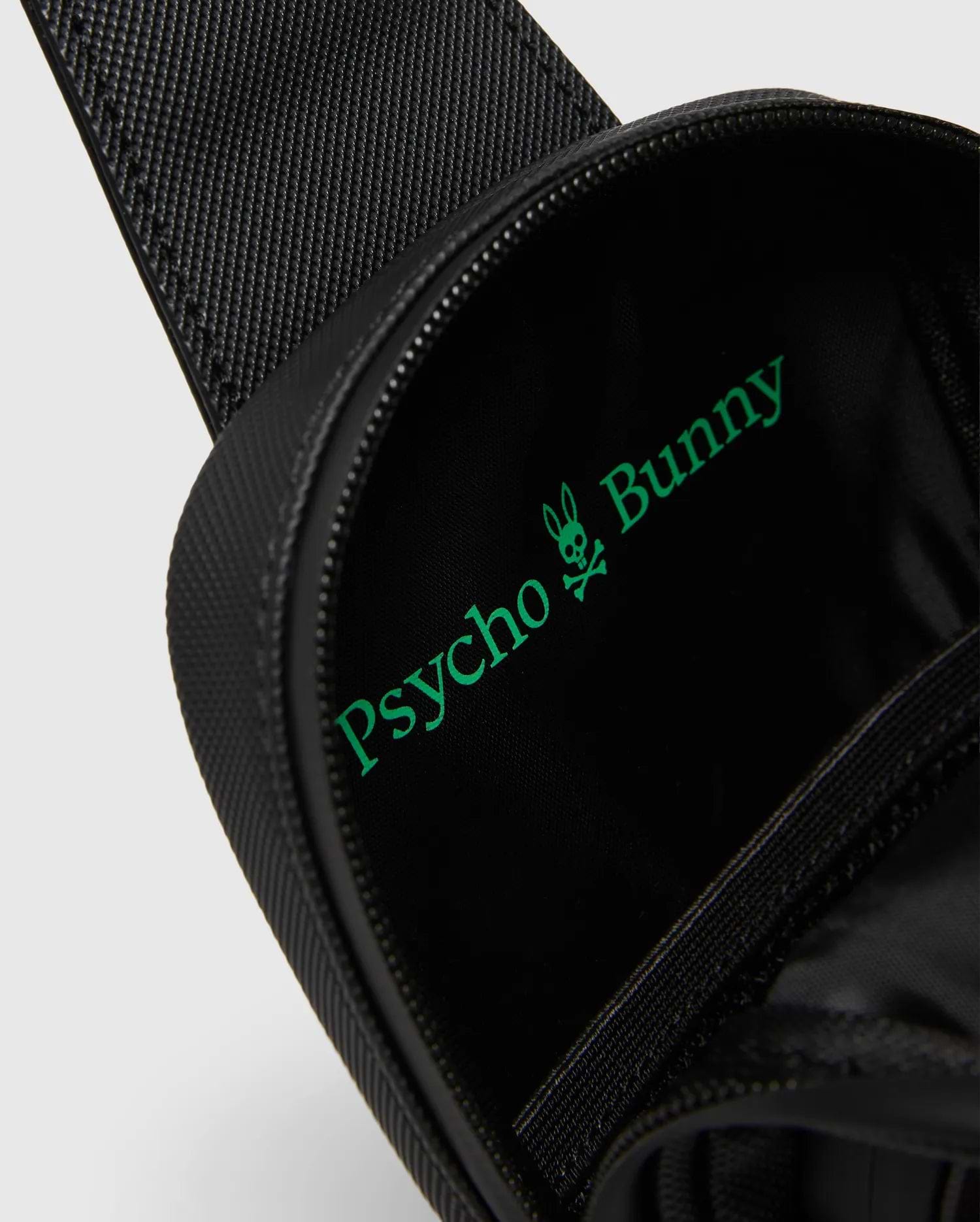 Black textured Crossbody Bag with a bright green Psycho Bunny logo and text printed large inside the main compartment, featuring a durable zipper closure. (2)