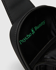 Black textured Crossbody Bag with a bright green Psycho Bunny logo and text printed large inside the main compartment, featuring a durable zipper closure. (2)