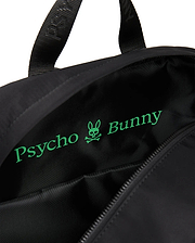 Mens Nylon Backpack in black, featuring a smooth nylon exterior and a bright green Psycho Bunny skull and text logo printed largely on the interior lining.