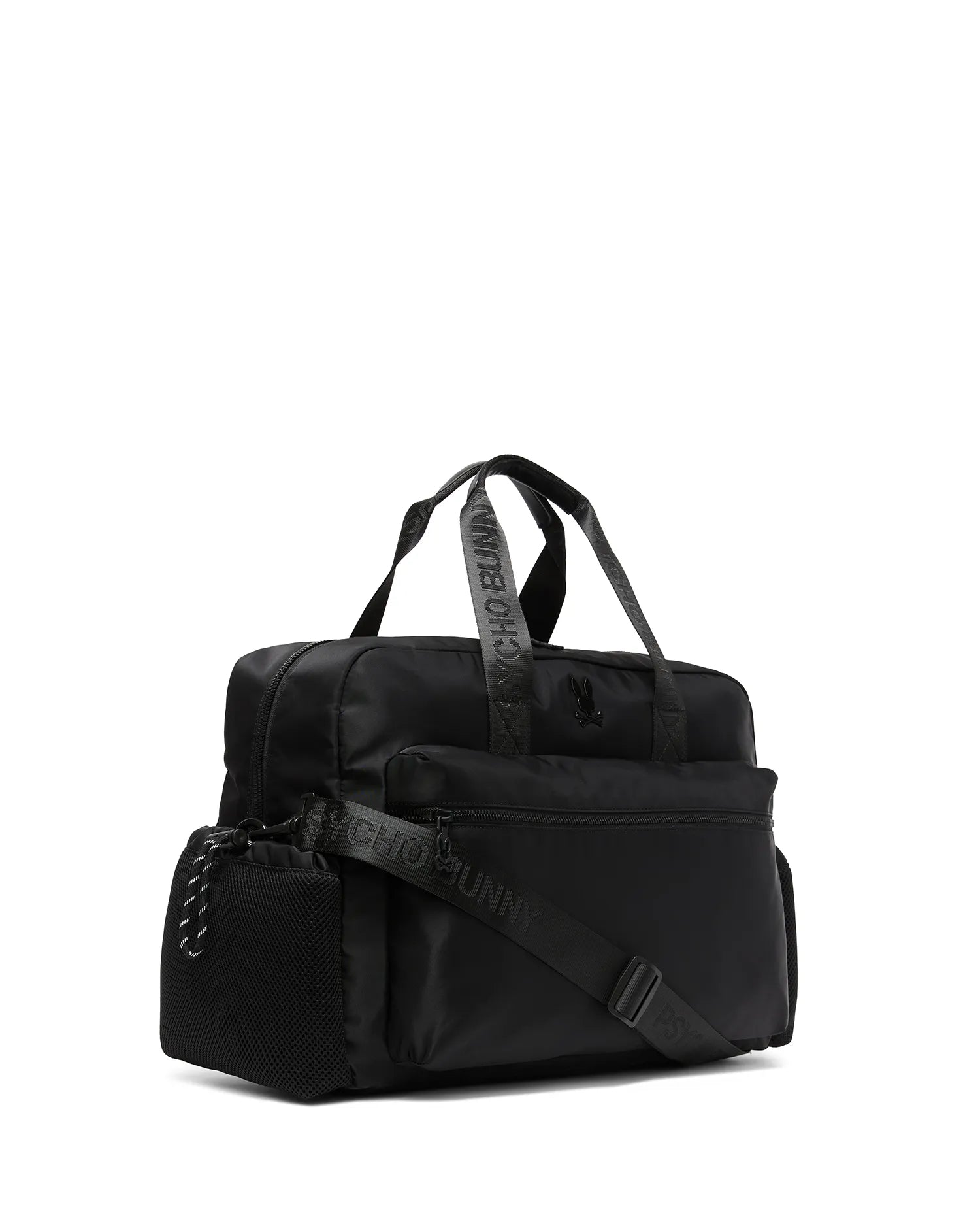 Mens Nylon Duffle Bag in black, featuring smooth nylon fabric, a mesh side pocket, multiple zippered compartments, top handles, and an adjustable strap with repeated Psycho Bunny text. A small black bunny skull logo is on the front. (1)