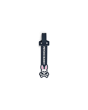 Mens Silicone Strap Luggage Tag, a sleek dark navy blue silicone strap featuring prominent vertical white PSYCHO BUNNY text and a large, detailed white and pink bunny skull logo.